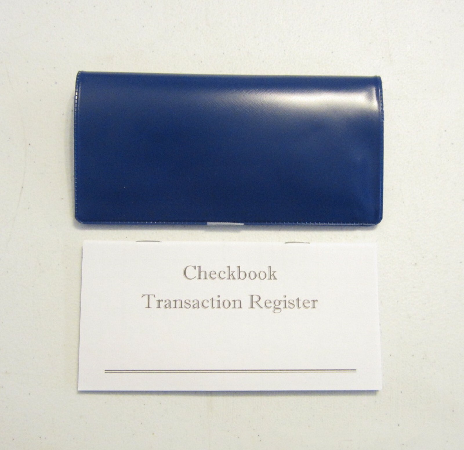 1 ROYAL BLUE VINYL CHECK BOOK COVER & 6 CHECKBOOK TRANSACTION REGISTERS
