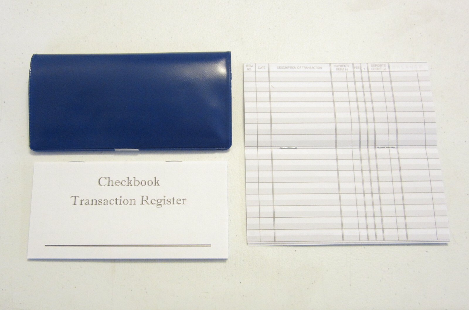 1 ROYAL BLUE VINYL CHECK BOOK COVER & 6 CHECKBOOK TRANSACTION REGISTERS