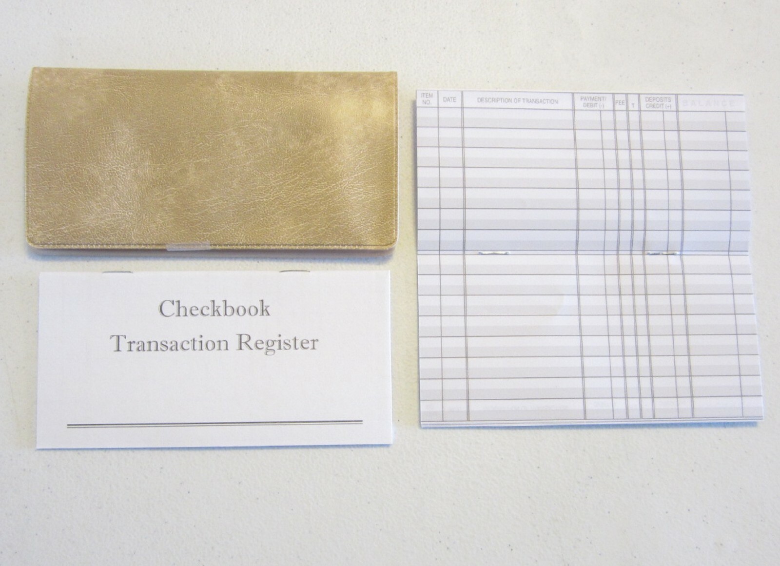 1 WHITE PARCHMENT VINYL CHECK BOOK COVER & 6 CHECKBOOK TRANSACTION REGISTERS