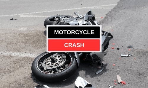 A crashed motorcycle lying on the ground and a written text of "motorcycle crash".